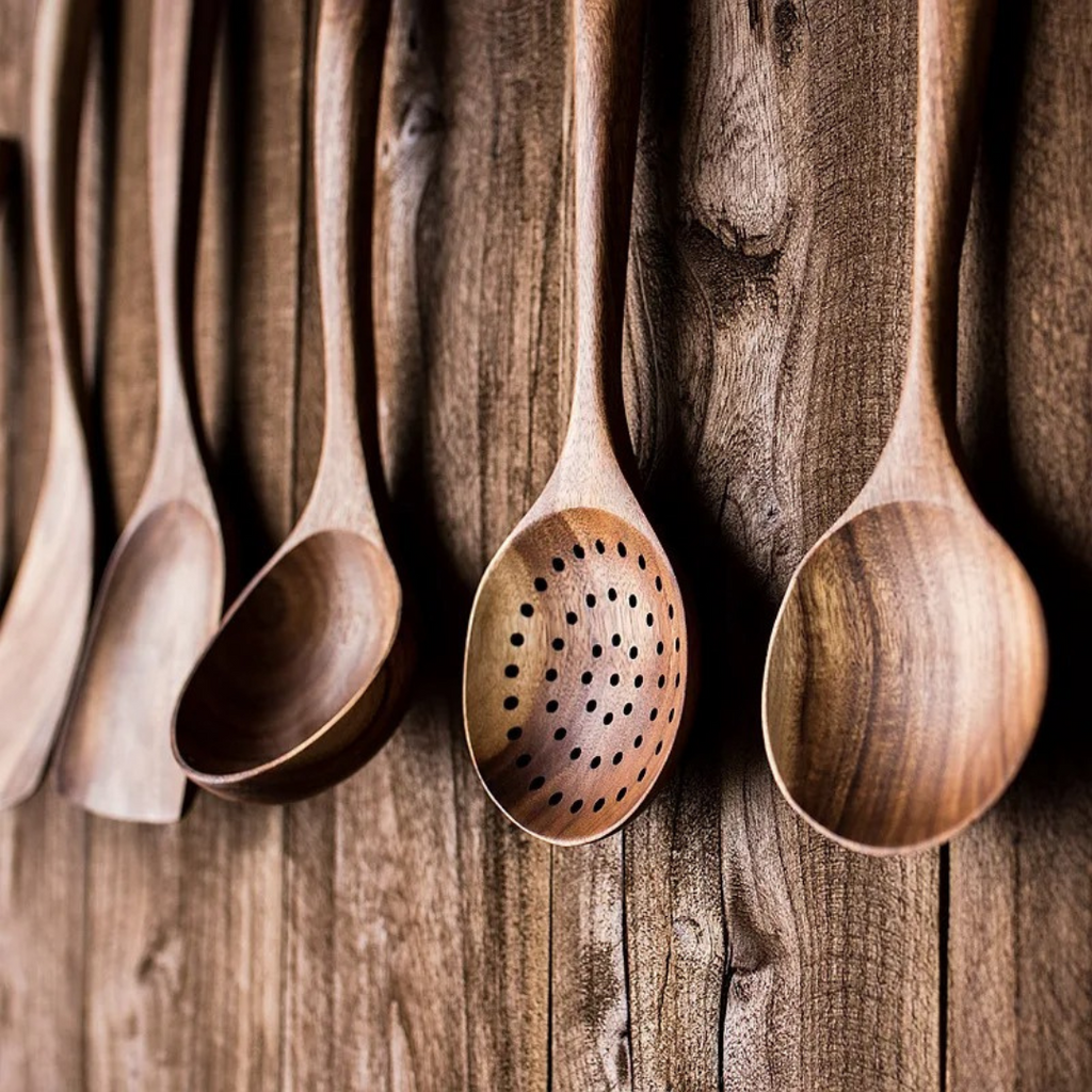 5-piece walnut kitchenware set featuring rustic design tools for cooking and serving, including a spatula, spoon, tongs, and more. 4