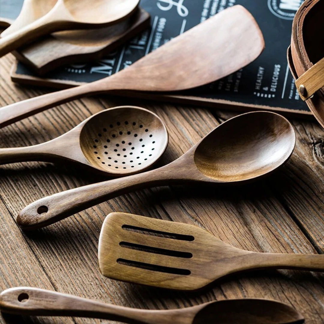 5-piece walnut kitchenware set featuring rustic design tools for cooking and serving, including a spatula, spoon, tongs, and more. 5
