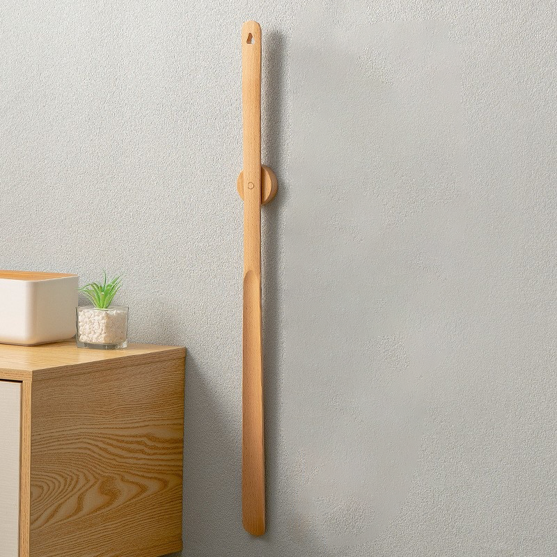 Long handled shoe horn made of solid wood, measuring 50 cm, designed for effortless shoe wearing and added comfort. 6